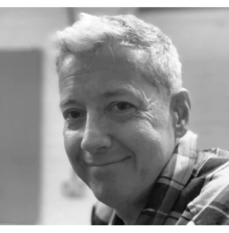 A black and white headshot of Noel McDermott