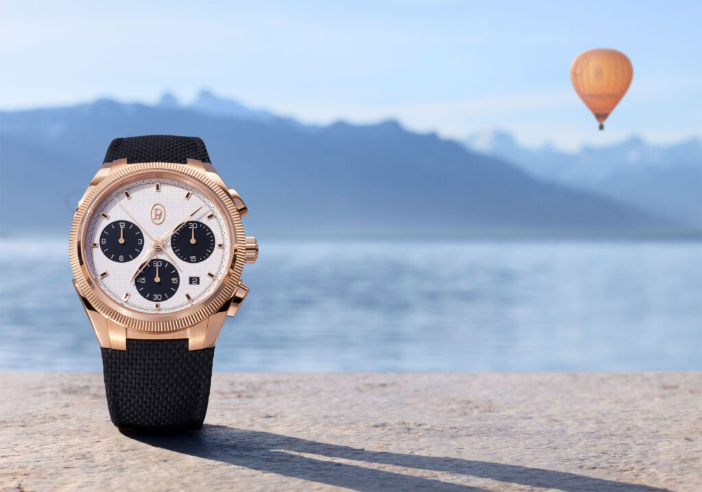 One of the company's gold chronograph models on a beach in Malaysia
