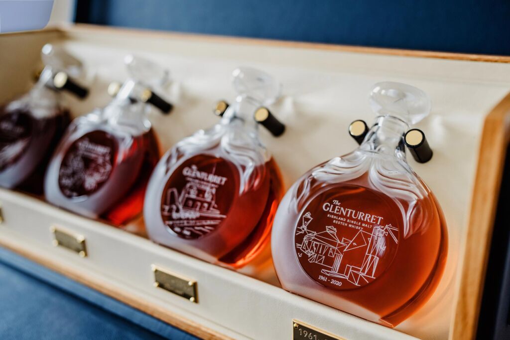 The four bottle laying inside their case