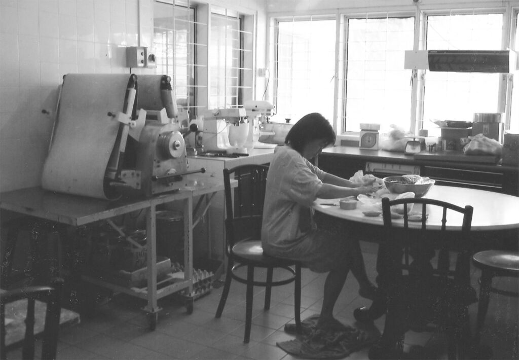 Maria working in the family's kitchen in the early days