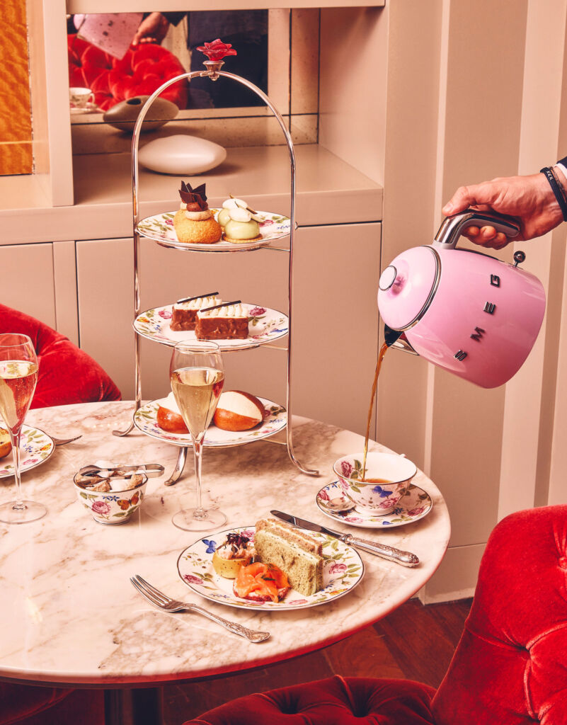 Tea being poured from a pink coloured SMEG kettle