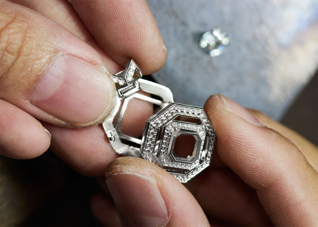 A jeweller assembling one of the pieces
