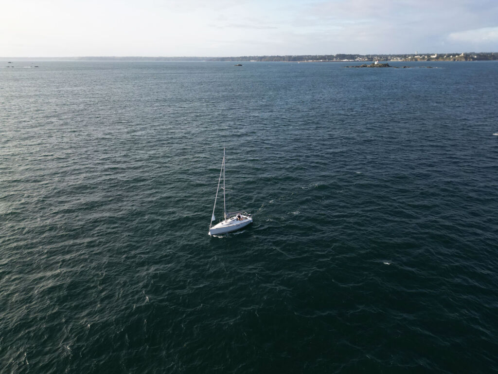 An aerial view of a boat on the open sea