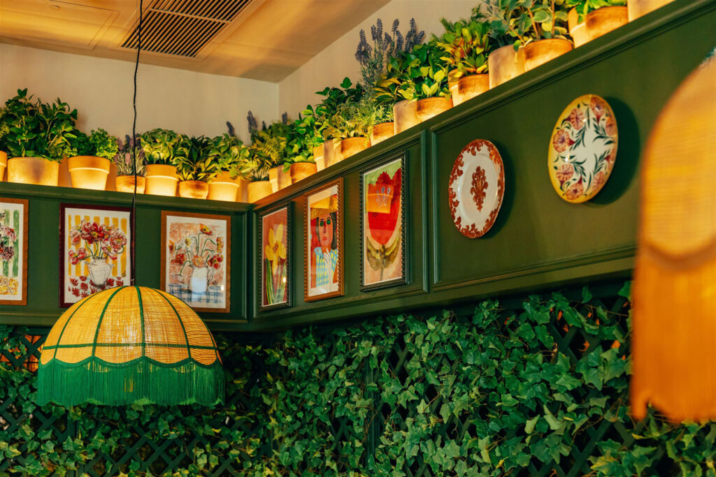 The restaurant walls adorned with Italian-themed decor