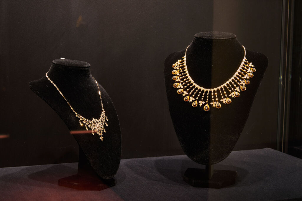 Two of the historical gold necklaces in a display case