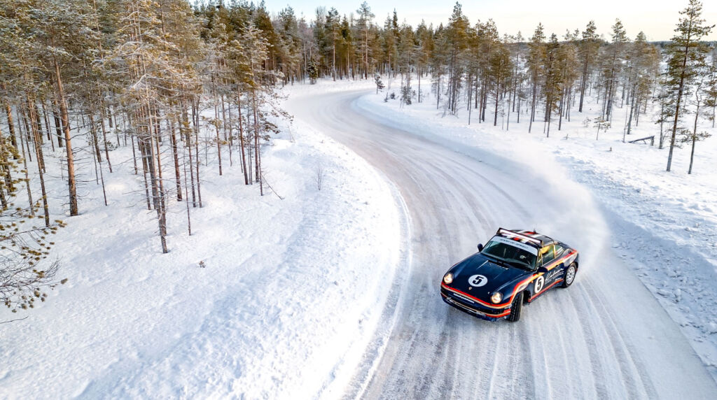A classic Porsche powersliding around a corner on the ice