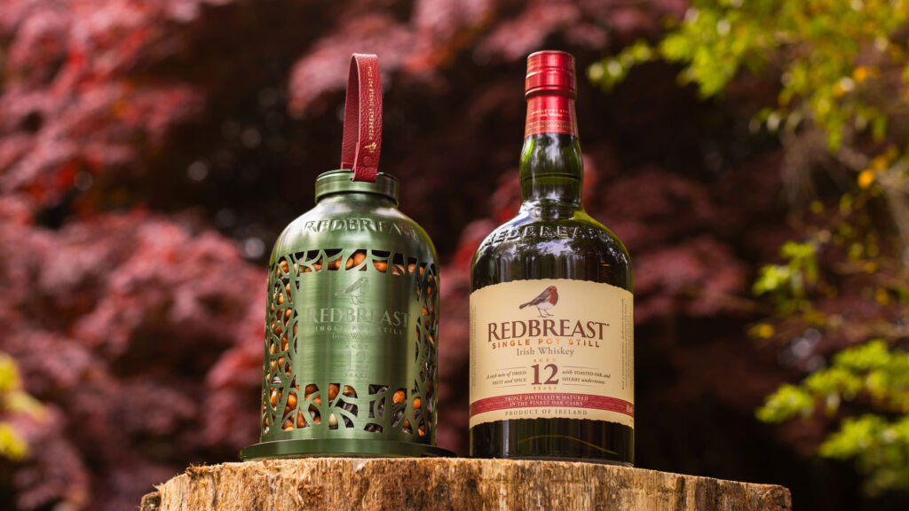 A bottle of the Redbreast 12 year old next to the green bird feeder