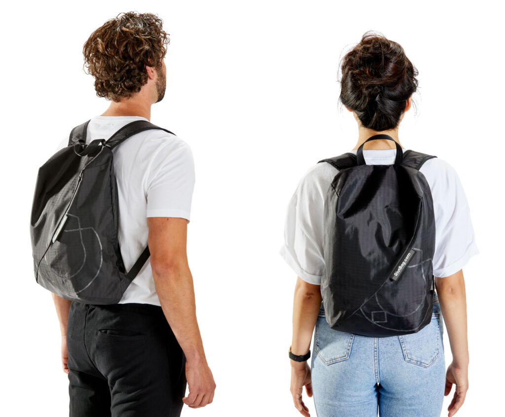 A male and a female wearing the innovative backpack