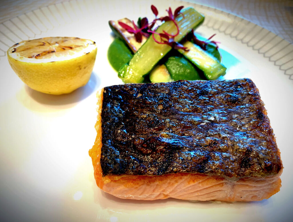 The salmon fillet dish with a vegetable side