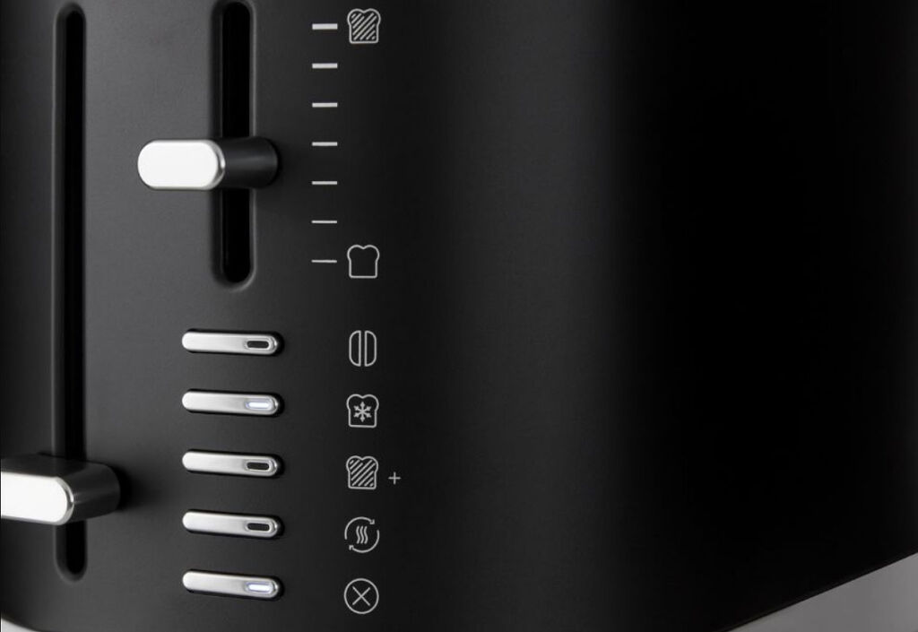 A closeup view of the buttons on the toaster