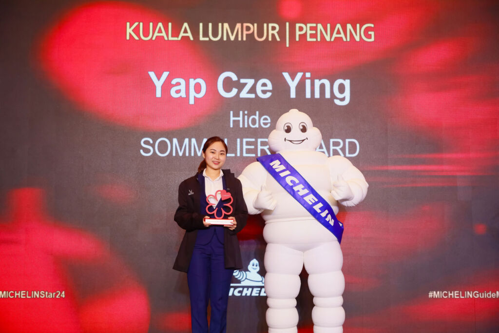 Yap Cze Ying getting her award on stage