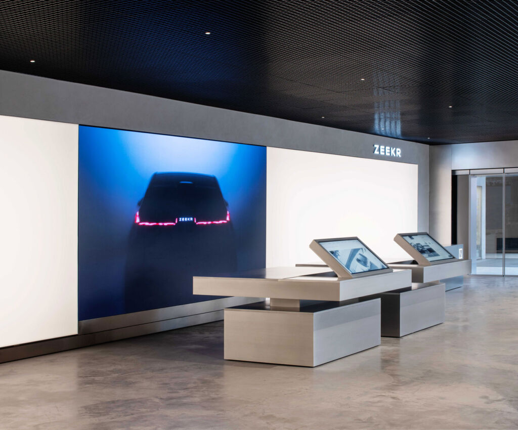 The large LED screens inside the showroom