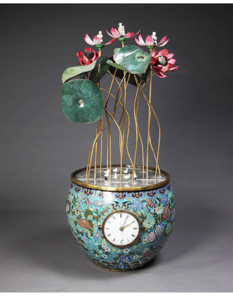 A floral designed clock with gold stems