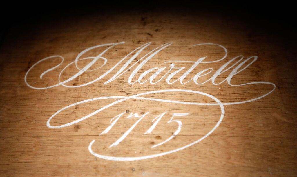 The Maison's signature and the date 1715 on wood