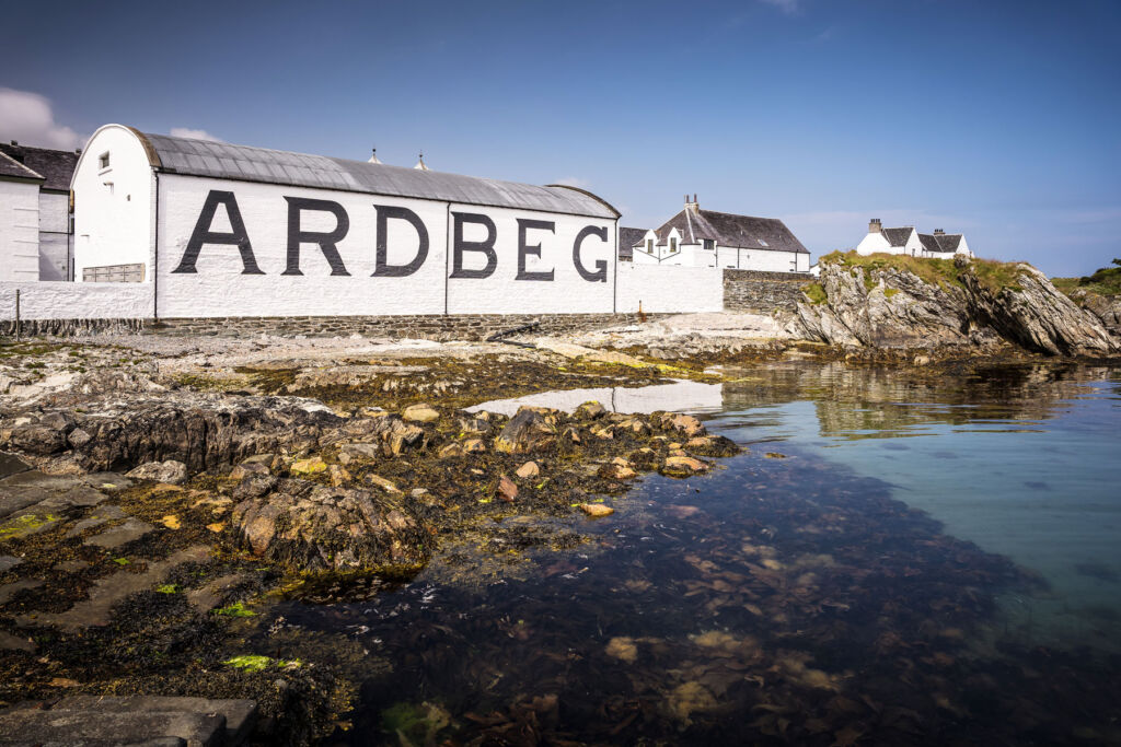 A photograph showing the distillery's location on the waterfront on a bright sunny day