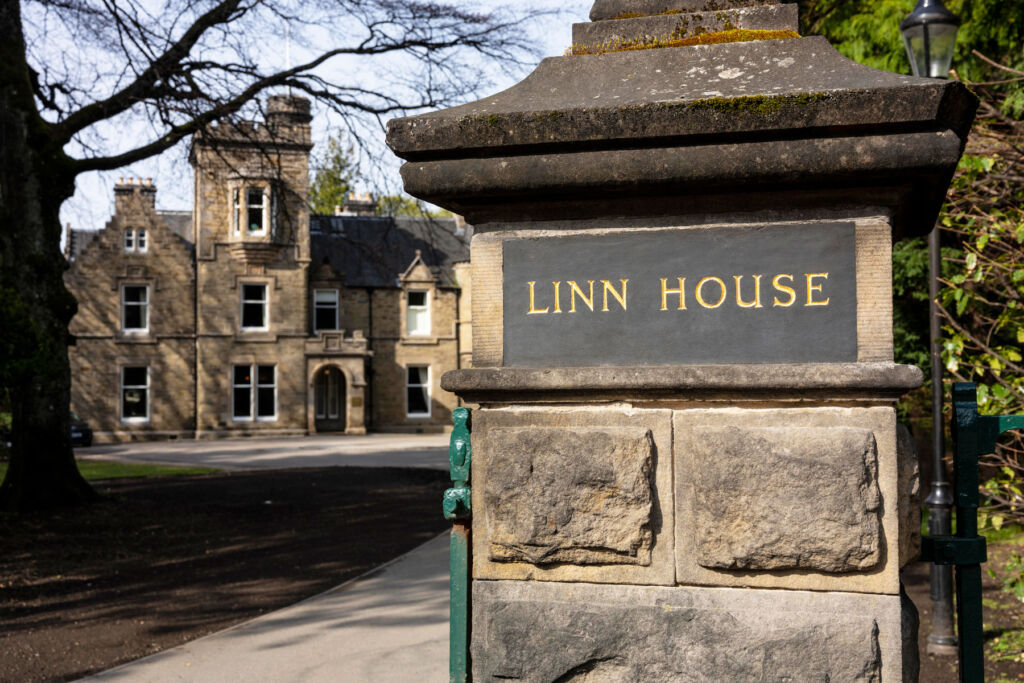 A photograph of the slate sign at the entrance to Linn House