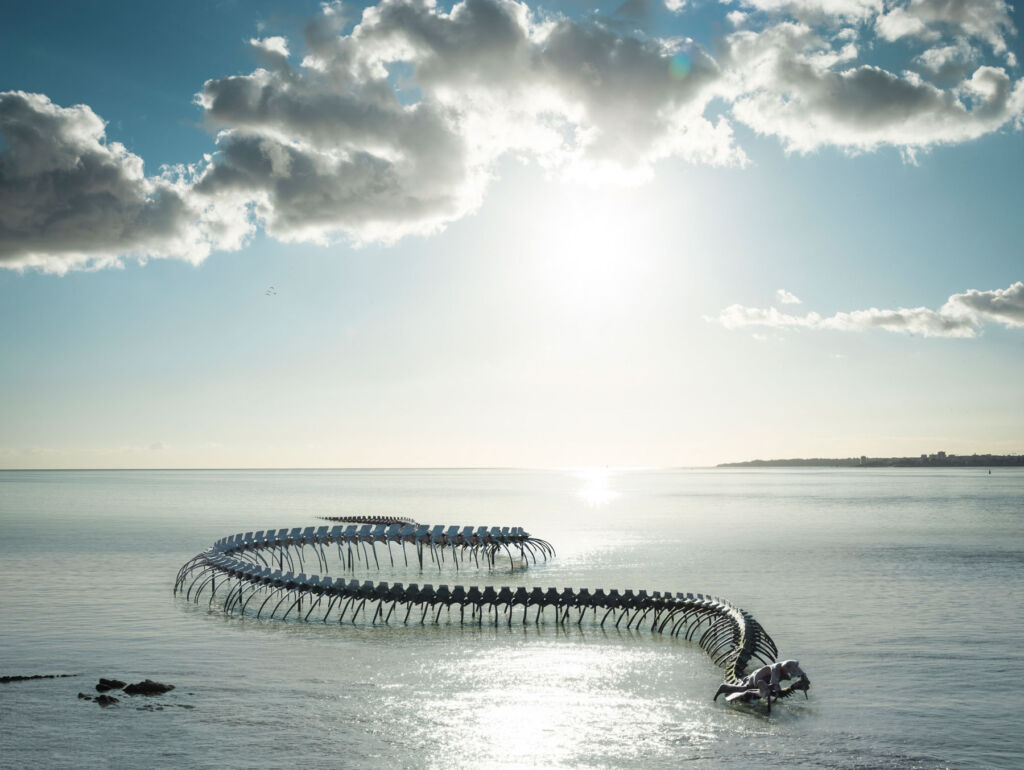 Huang Yong Ping's Ocean Spirit Sculpture with the sun glistening off the water