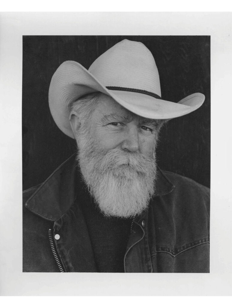 A black and white photograph of the American artist James Turrell wearing a stetson hat