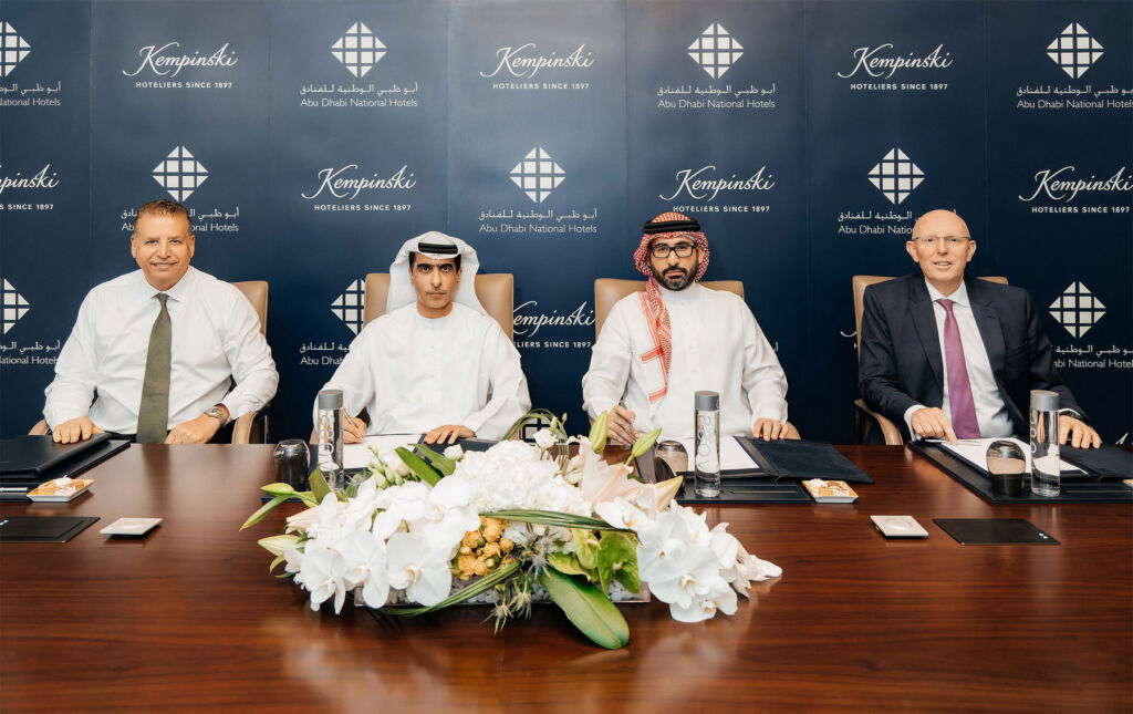 Representatives of kempinski Hotels and Abu Dhabi National Hotels signing the rebranding agreement
