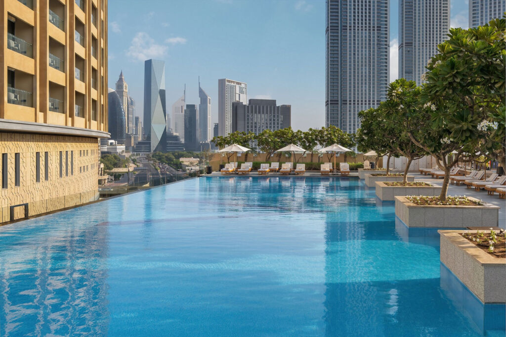 The pool at one of the properties with the hi-rise skyline in the background
