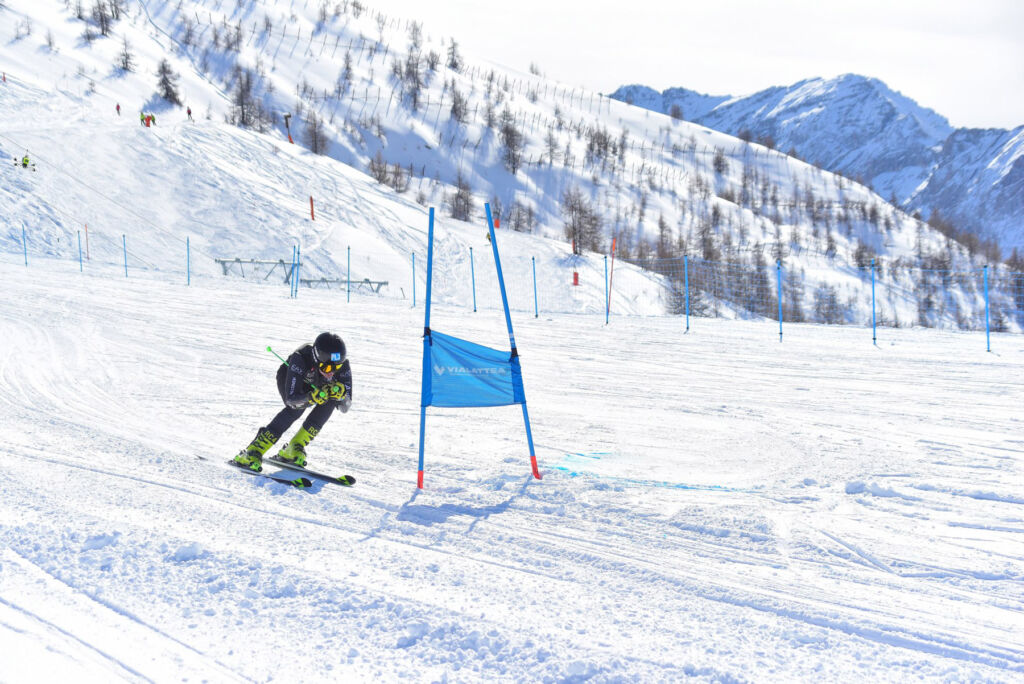 An experienced skier speeding down one of the more advanced slopes