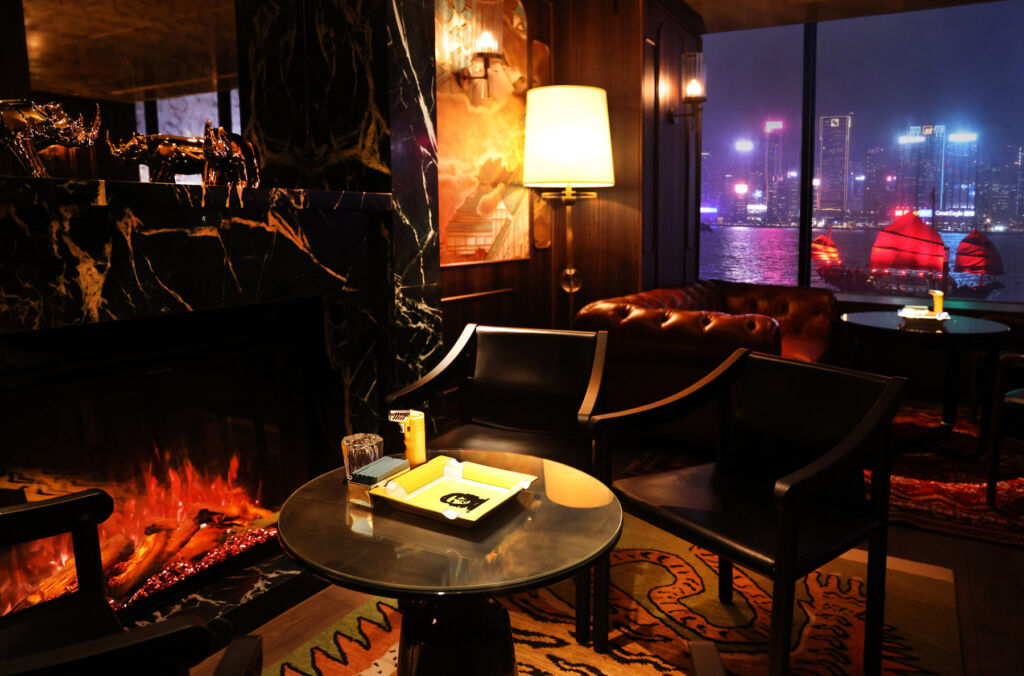 Qura Bar Opens Bringing a Sensory Odyssey, Rare Spirits and Hypnotic Views 15 A cosy table with views of the harbour