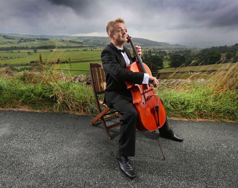 Ben Crick playing a Cello outdoors in the Dales
