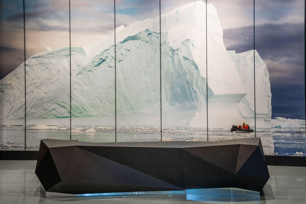 A large wall mural displaying an iceberg