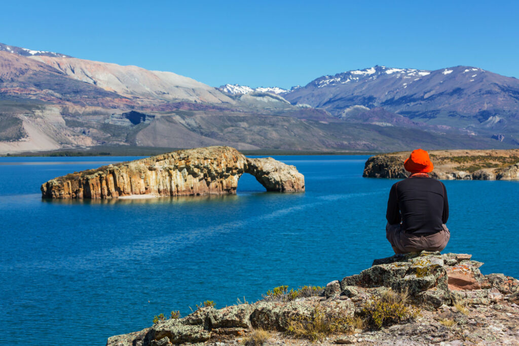 An older woman looking at a lake in Patagonia