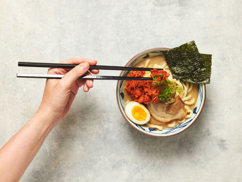 A Reward for Sprouting Some Joy this Christmas at Marugame Udon 5 A person tucking into a tasty looking bowl using chopsticks