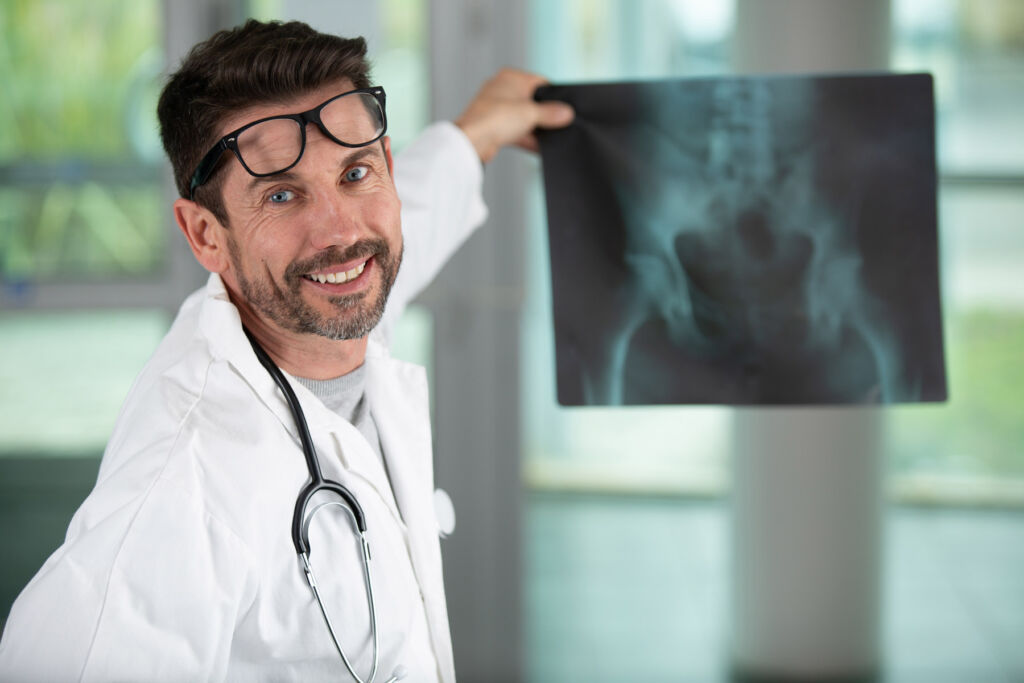 A Doctor holding up a pelvic x-ray