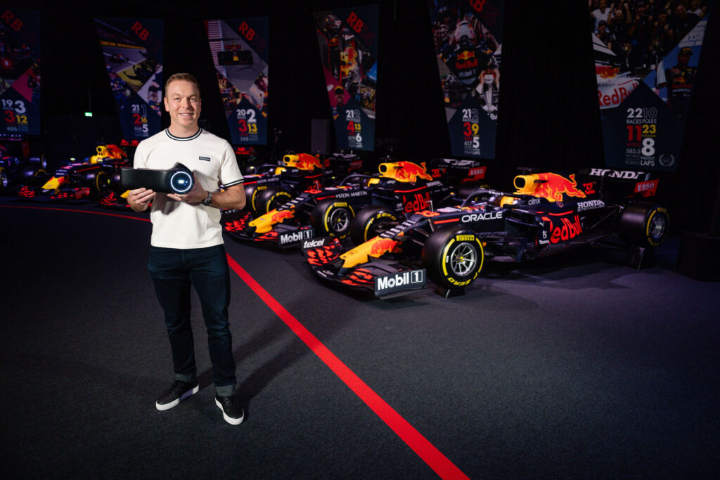 Sir Chris Hoy holding the device in the Red Bull Museum