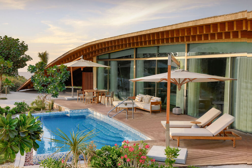 The exterior and pool area that comes with a one bedroom Dune Villa