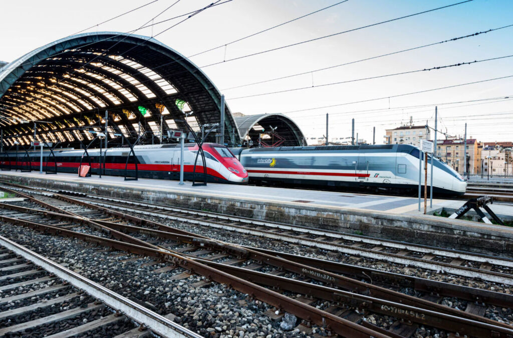 Two high-speed trains side by side at the station