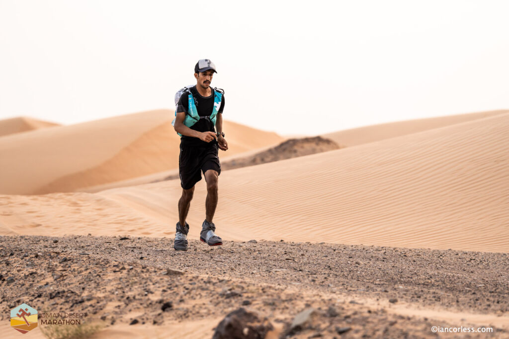 A male runner on his own in the desert