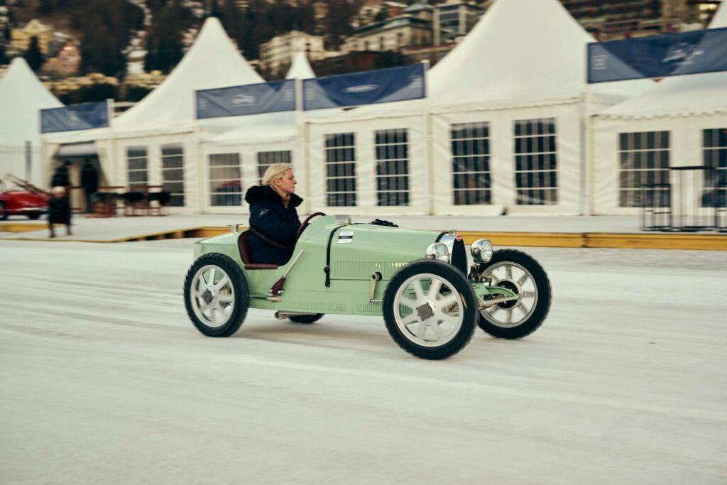 A woman having run driving one of the scale Bugatti model
cars