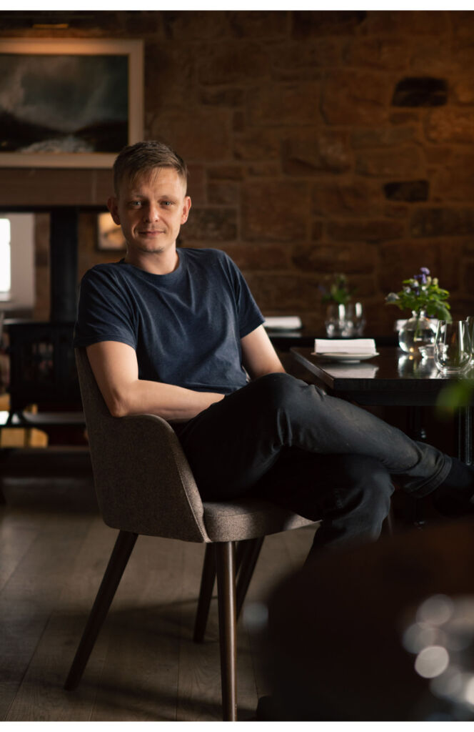 Cumbria's Pentonbridge Inn Celebrates Retaining its Michelin Star 4 Chris sitting at a table in the restaurant