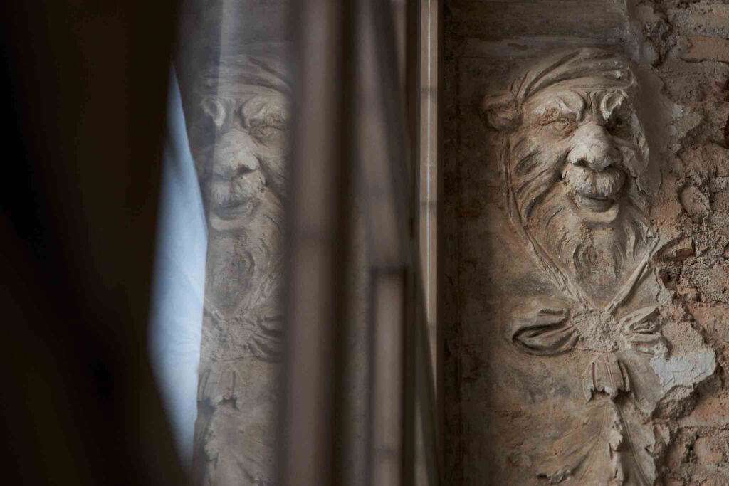 The ancient stone carvings on the columns
