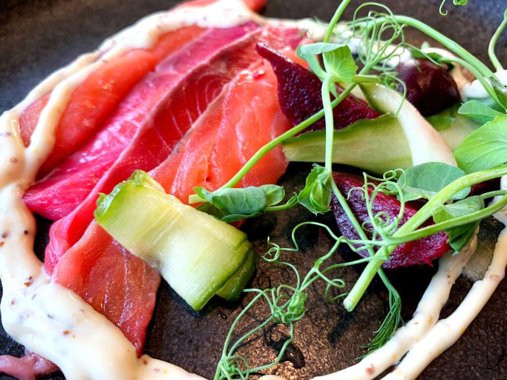 A photograph of the beetroot cured salmon dish