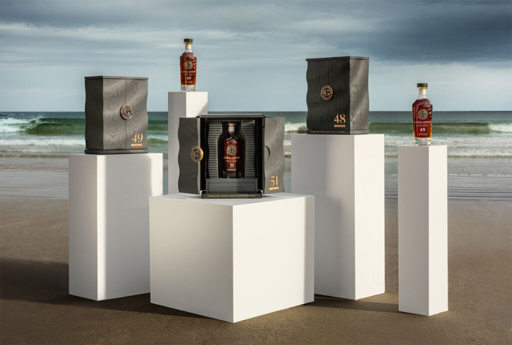 The bottles on the new collection placed on columns on the beach