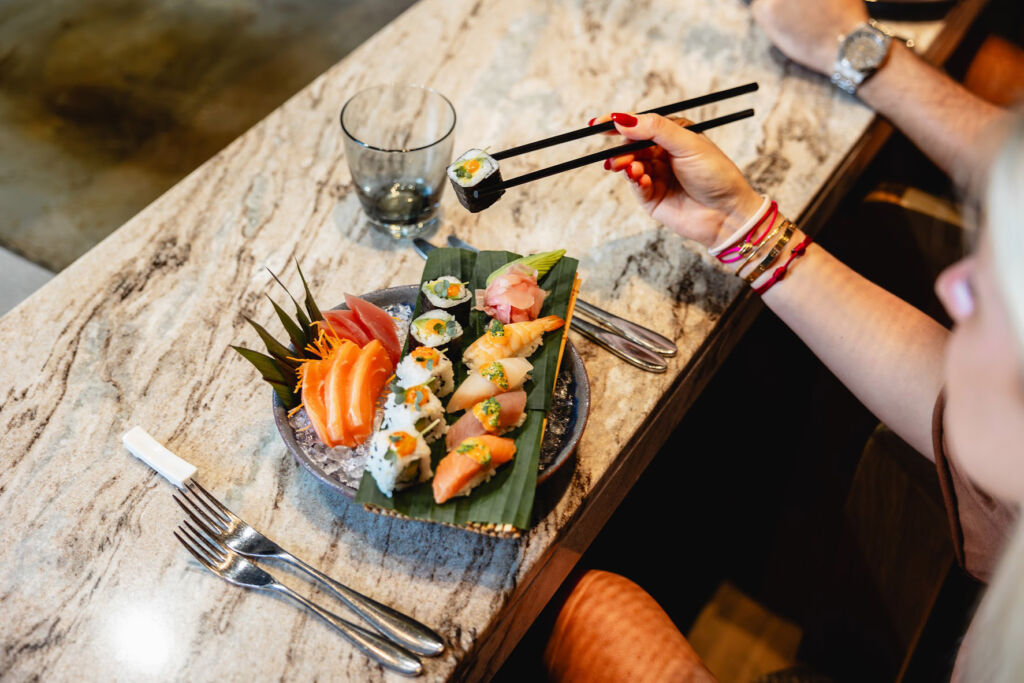 Ladies enjoying fresh sushi in the restaurant