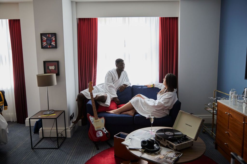 A couple relaxing in their suite