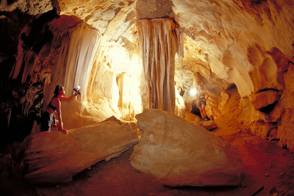 Two young woman exploring Al Hoota Cave