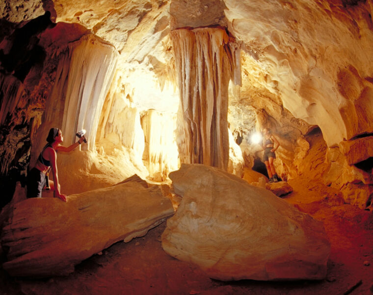 Two young woman exploring Al Hoota Cave