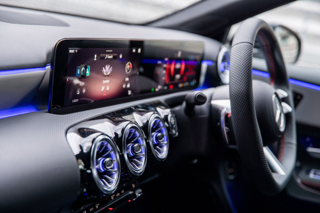 The 10" wide screen displaying vehicle information and proving access to the infotainment options