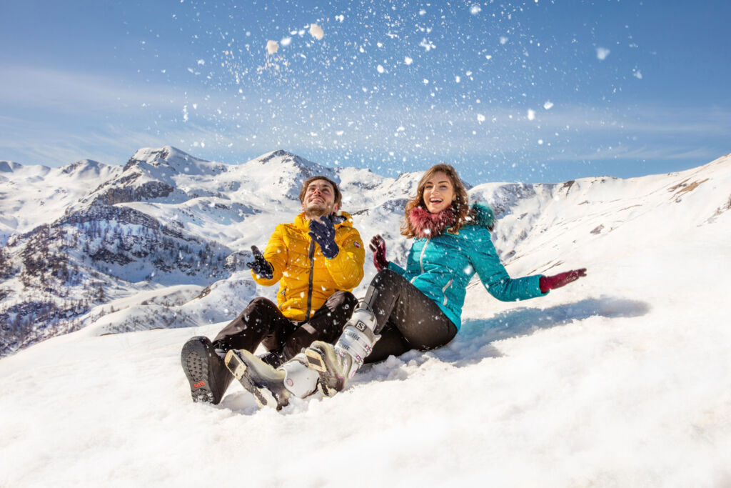 Food and Adventure in Cuneo and Turin at the Foot of The Piedmont Alps 18 A young man and woman playing with the fresh snow