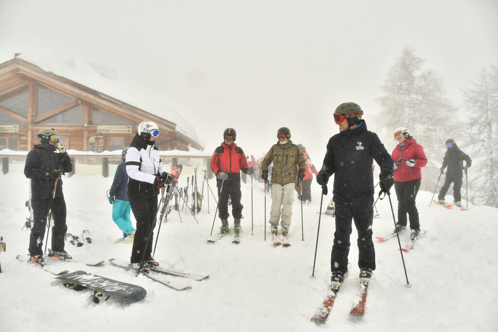 A group of skiers readying themselves for time on the snowy slopes