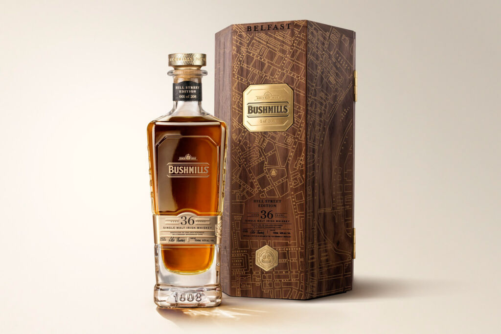 A bottle of Bushmills Hill Street Edition single malt Irish whiskey next to its case