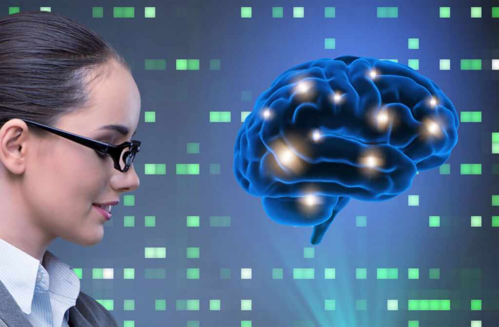 A graphic showing a brain next to a business woman