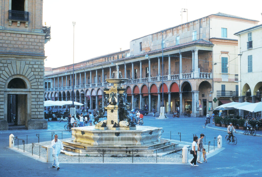 A stone fountain in the Faenza town square